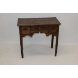 18th century fruitwood lowboy with moulded rectangular and three frieze drawers above fret-carved