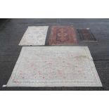 Persian rug, centred by three quartered medallions within borders, 168cm x 124cm,