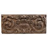 17th century relief carved oak panel with oval cartouche dated 1656 within scrolling acanthus