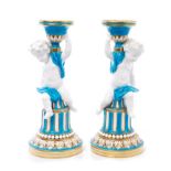 Pair Victorian Minton porcelain candlesticks in the form of putti on columns, with gilt,