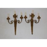 Pair of ornate Adams-style wall lights with fluted swag and urn caped tapering column issuing three
