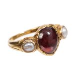 Victorian three stone ring with pear-shape cabochon garnet / orange stone flanked by two half