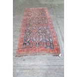 Antique Persian carpet, allover angular birds, animal and floral motifs within borders,