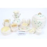 Collection of Belleek porcelain - including biscuit barrel and cover, vases, jugs, condiments,