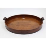 Georgian mahogany oval tray with deep sides and scroll handles,