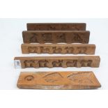 Two pairs 19th century treen biscuit moulds carved with elephant, dog, cat, sheep, chickens,