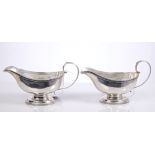 Pair George III silver footed sauce boats of conventional form,