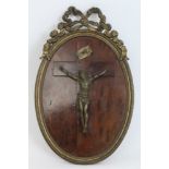 19th century ormolu figure of Christ on the cross, in oval ormolu frame with ribbon mount,