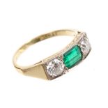 Emerald and diamond three stone ring, the rectangular step cut emerald measuring approximately 6.