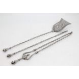 Set of three Georgian steel fire implements with spiral-twist shafts and faceted turned handles -