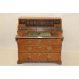 Early 18th century walnut crossbanded bureau with hinged fall enclosing fitted interior of short