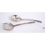 Pair Mexican silver salad servers of plain form, with flattened handles and flower-head terminals,