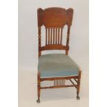 Unusual early 20th century beech side chair with carved high panel back,