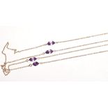 1920s long chain with sections of yellow metal links interspaced by eight amethyst and faceted