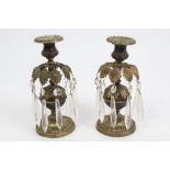 Pair Regency bronze lustre candlesticks with sunflower and leaf decoration, prismatic drops,