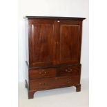 George III mahogany linen press on chest with Greek key pediment,