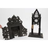 Unusual early 19th century cast iron miniature fireplace with grate and cast Royal Arms and floral