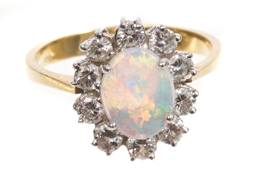 Opal and diamond cluster ring, the oval opal cabochon measuring 8.80mm x 6.85mm x 1. - Image 2 of 3