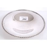 Continental silver dish of circular form, with leaf and reeded border,