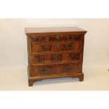 Early 18th century and later yew and oak chest of drawers having four long graduated drawers on