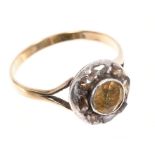 Antique citrine and diamond cluster ring with a central round mixed cut citrine surrounded by eight