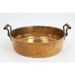 Victorian bell metal preserve pan flanked by twin scrolling handles,
