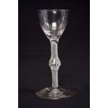 Georgian cordial glass, circa 1760, with fluted bowl with central swollen stem with opaque twist,