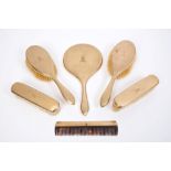 Fine quality gold (9ct) dressing table set - comprising a hand mirror, a pair of hairbrushes,