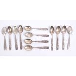 Set of twelve Continental silver coffee spoons with fluted bowls and floral stems,