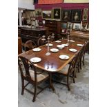 Georgian-style mahogany and satinwood crossbanded twin pedestal extending dining table of rounded