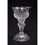 Georgian sweetmeat glass, circa 1750, with petal-shaped ogee bowl with facet cut decoration,