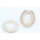 Pair 19th century Cantonese carved ivory oval frames with carved floral decoration and easel backs,