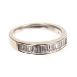 White gold (18ct) diamond half hoop eternity ring with a band of channel set baguette cut diamonds