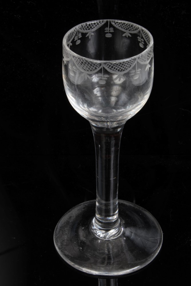 Mid-18th century cordial glass with conical bowl, engraved with swags and flowers,