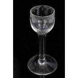 Mid-18th century cordial glass with conical bowl, engraved with swags and flowers,