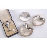 Pair of Victorian silver butter shells of conventional form, on three ball feet (London 1888),