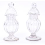 Pair mid-18th century glass vases and covers with ribbed decoration, on splayed foot,