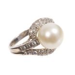 Cultured pearl and diamond dress ring with a central cultured pearl measuring 10.