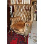 Good early 20th century button leather upholstered bow back armchair fully close stud upholstered