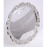 Victorian silver salver of circular form, with stylised shell decoration and crimped border,