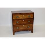 Regency mahogany crossbanded chest of drawers of small size with three graduated drawers on bracket