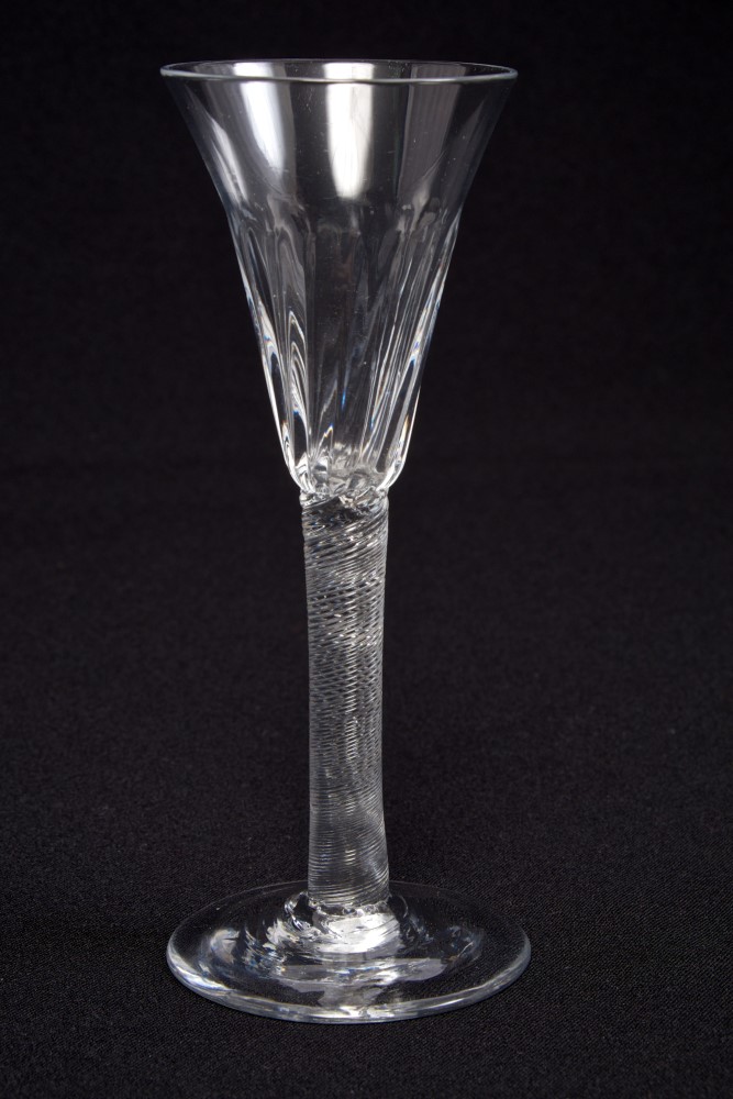 Georgian wine glass, circa 1760, with funnel bowl with moulded flutes,