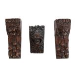 Pair of antique carved oak corbels in the form of lion masks, 22cm high, possibly 17th century,