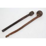 19th century African wooden war club with bulbous end and carved handle decorated with topless