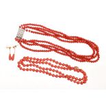 Red coral bead necklace with a single string of polished round beads, approximately 6.