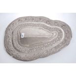 Contemporary Singalese white metal dish of irregular form,