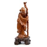 Late 19th century Chinese carved boxwood figure of Shou Star - the God of Longevity holding a peach