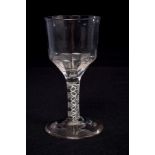 Georgian wine glass, circa 1760, with moulded ogee bowl and double opaque twist stem on domed foot,