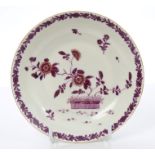 Rare 18th century Worcester saucer, painted in puce in the Meissen style, with flowers,