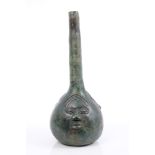 Antique African possibly Benin bronze bottle vase decorated with three human masks and green